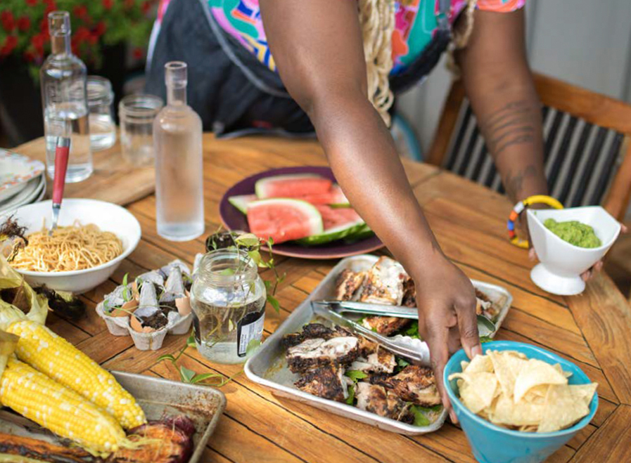 Barr sets the table with the various dishes she has cooked up.